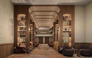 a lobby with a vaulted ceiling with chairs and bookshelves at Villa Sahrai, a Member of Design Hotels in Casablanca