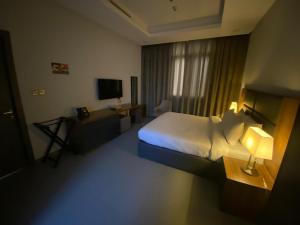 Saray Prime Suites客房内的一张或多张床位