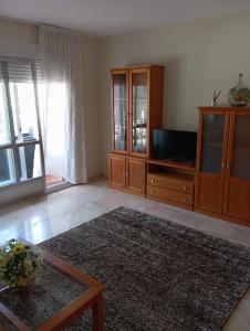 Μια τηλεόραση ή/και κέντρο ψυχαγωγίας στο Apartamento 1 en Combarro , próximo a Sanxenxo