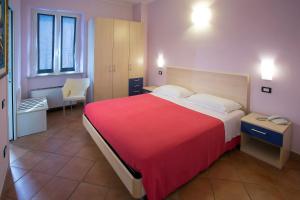 A bed or beds in a room at Hotel Vila Bahia