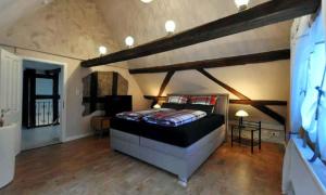 a bedroom with a large bed in a room at Ferienhaus Gründaublick in Gründau