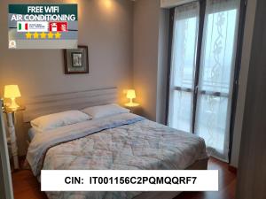 Voodi või voodid majutusasutuse Elegant Apartment "Le Fontane"-BORGO MERCATO-MONCALIERI toas
