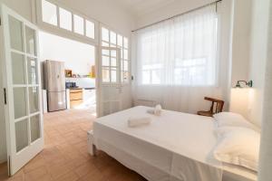 Ένα ή περισσότερα κρεβάτια σε δωμάτιο στο Casa Tharros +59 φωτογραφίες