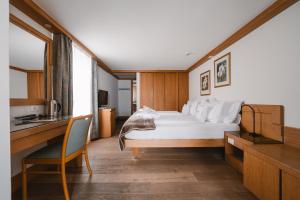 Postel nebo postele na pokoji v ubytování Sertorelli Sporthotel
