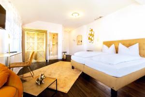 Postel nebo postele na pokoji v ubytování Hotel Villa WUN