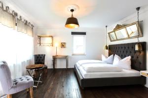 Postel nebo postele na pokoji v ubytování Hotel Villa WUN