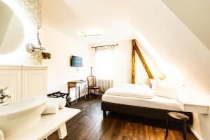 Postel nebo postele na pokoji v ubytování Hotel Villa WUN