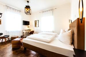 Postel nebo postele na pokoji v ubytování Hotel Villa WUN
