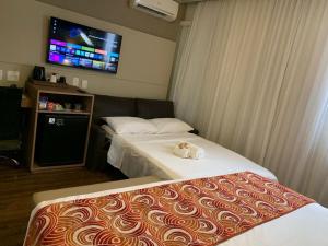 Letto o letti in una camera di Quality Faria Lima