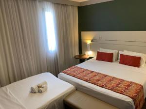 Letto o letti in una camera di Quality Faria Lima