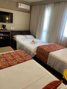 Letto o letti in una camera di Quality Faria Lima