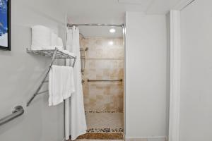 a bathroom with a shower with a shower curtain at Crowne Plaza Orlando-Downtown by IHG in Orlando