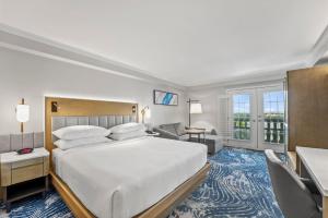 a hotel room with a bed and a desk at Crowne Plaza Orlando-Downtown by IHG in Orlando