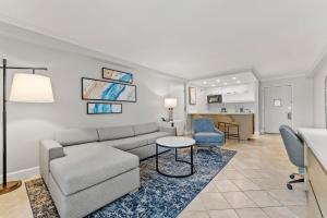 a living room with a couch and a table at Crowne Plaza Orlando-Downtown by IHG in Orlando