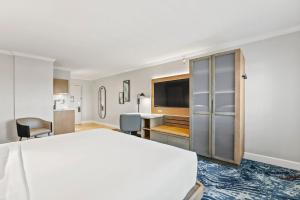 a hotel room with a bed and a desk at Crowne Plaza Orlando-Downtown by IHG in Orlando