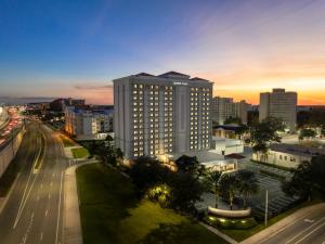 a city skyline with a tall building and a street at Crowne Plaza Orlando-Downtown by IHG in Orlando