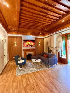 a living room with a couch and a table at VILLA 34 - 4 Masters, Moroccan Charm & Modern Comfort with Private Pool in Marrakesh