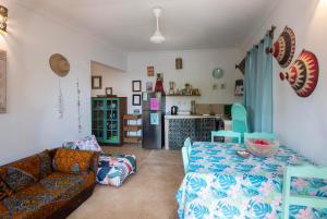 a living room with a couch and a kitchen at FURAHA VILLA 3 in Chanjani