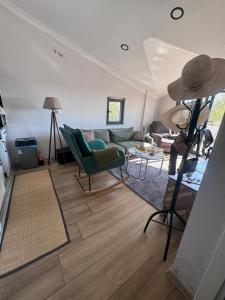 a living room with a couch and a table at ByLotos in Side