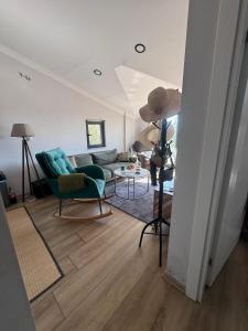 a living room with a couch and a table at ByLotos in Side +7 photos