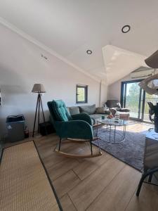 a living room with a couch and a table at ByLotos in Side
