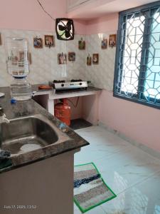 a kitchen with a sink and a counter top at Villa VOC in Puducherry