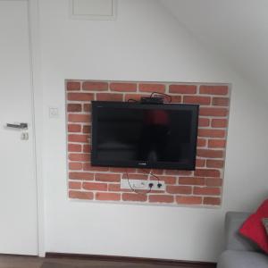 TV a/nebo společenská místnost v ubytování Apartament Muzyczny
