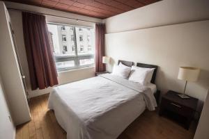 Postel nebo postele na pokoji v ubytování Hotel Belley