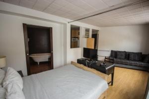 Postel nebo postele na pokoji v ubytování Hotel Belley