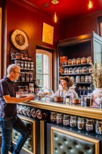 two people standing at a counter in a kitchen at Château de la Tourlandry in Chemillé