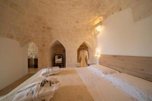 Posteľ alebo postele v izbe v ubytovaní IL Trullo Di Mamma Lucia-Luxury Villa