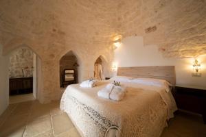 Posteľ alebo postele v izbe v ubytovaní IL Trullo Di Mamma Lucia-Luxury Villa