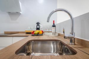 Η κουζίνα ή μικρή κουζίνα στο Puerto Rico Beachside Holidays