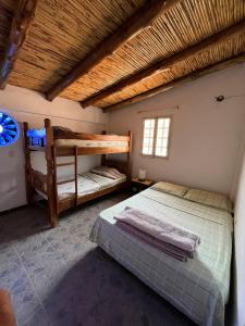 Кровать или кровати в номере MI CABAÑA DE LOS ANDES Apartaderos Merida