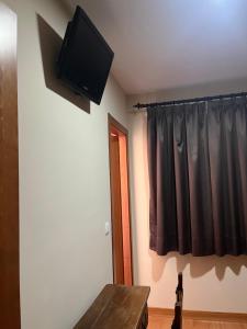 TV a/nebo společenská místnost v ubytování HostalLaPerdiz