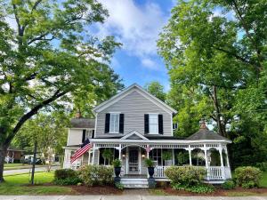 a house with an american flag on it at Blue Juniper Inn in Columbia