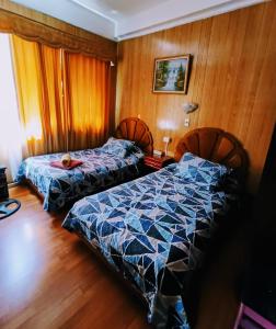 Postel nebo postele na pokoji v ubytování Hotel Di Maurier