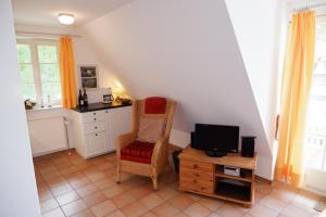 Η κουζίνα ή μικρή κουζίνα στο Achtern Diek Haus 8 Wohnung 4 +15 φωτογραφίες