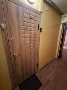 a door to a room with a sign on it at Butas KOMPaktiškas in Tauragė