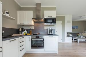 Kuchyň nebo kuchyňský kout v ubytování Zur Heiderose Haus 8 Villa Pebble + 8 fotografií