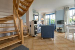 TV a/nebo společenská místnost v ubytování Wiesenstraße 65a Haus Casa Blue