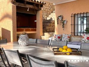 a table with a bowl of fruit on top of it at VH CostaBlanca - EVA in Benissa
