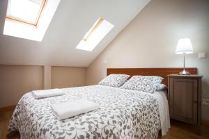 Łóżko lub łóżka w pokoju w obiekcie Fuencarral Apartments