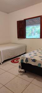 Ένα ή περισσότερα κρεβάτια σε δωμάτιο στο Recanto Da Paz