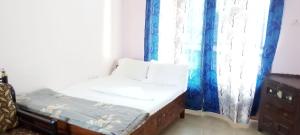 Postel nebo postele na pokoji v ubytování Richnest Apartment Colva Beach
