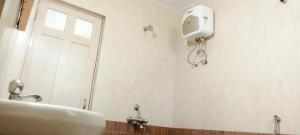 Koupelna v ubytování Richnest Apartment Colva Beach + 7 fotografií