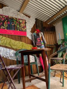 a table with a doll sitting on top of it at cabaña art fuerte aguayo in Valparaíso