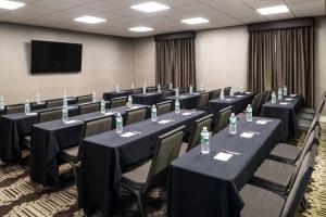 a conference room with tables and chairs with bottles of water at Residence Inn Boston Franklin in Franklin +86 photos