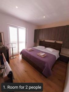 Posteľ alebo postele v izbe v ubytovaní Apartmens Beach house