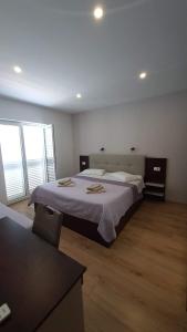 Posteľ alebo postele v izbe v ubytovaní Apartmens Beach house